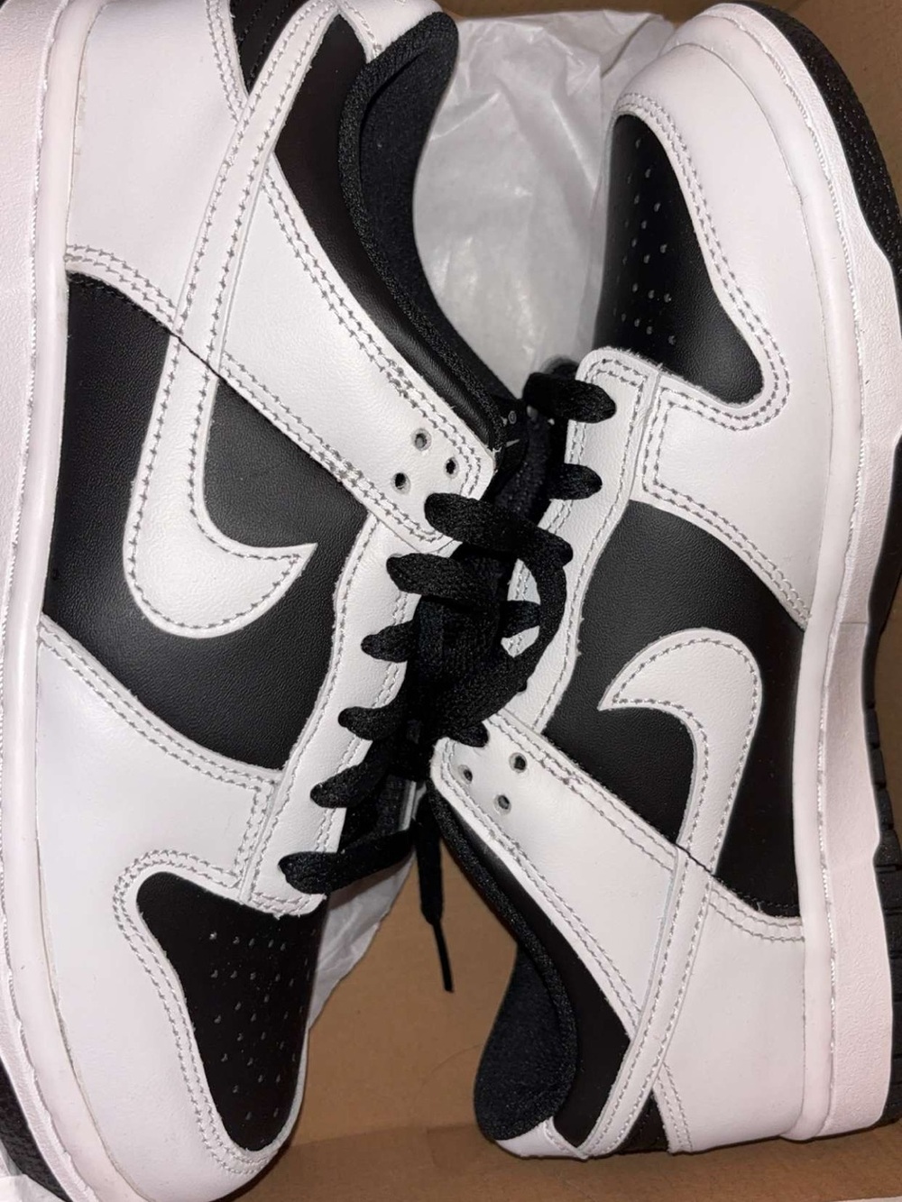 Woman's Black & White Low-Top Sneakers.